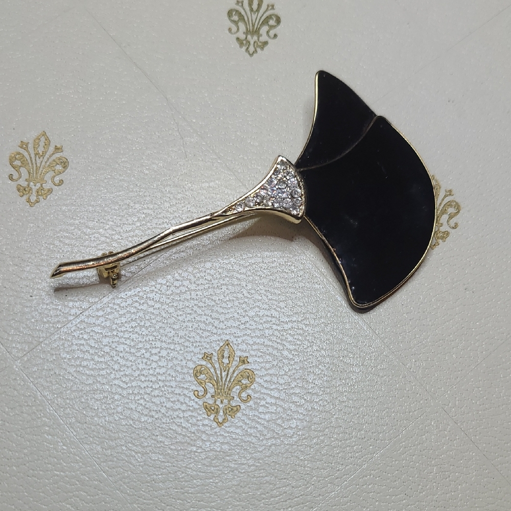 Vintage Black Enamel Stylized Floral Brooch with Gold-Tone Stem and Rhinestones